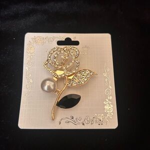 Elegant Rose Brooch with black rhinestone pedal gold tone